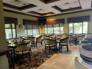 VCC grill room before renovation with tables and coffered ceiling
