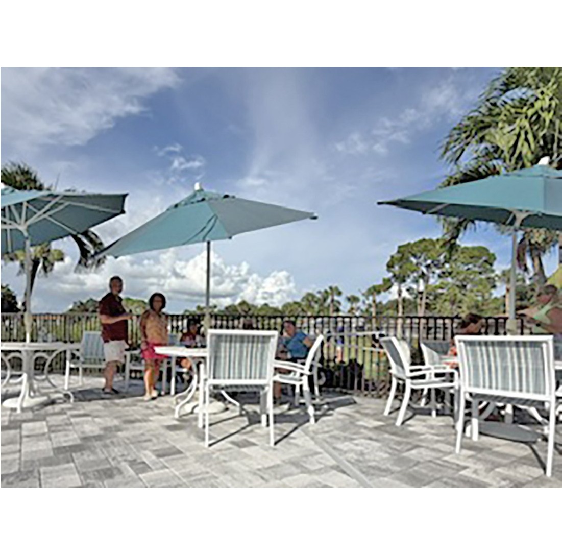 Creekers gathered under patio umbrellas at the 2026 VCC putting contest